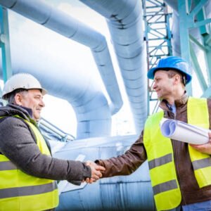 Oil refinery engineers handshake. Petrochemical and gas industry successful deal. Cooperation concept.