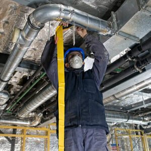 Worker Wrapping an HVAC Air Duct with Foil Tape